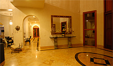 As you walk through the magnificent 15' mahogany double front doors, you will enter a very open and spacious living room area.